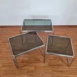 Set of 3 coffee tables from the 70s era. Made in Bauhaus style in Italy. Made of metal chromed legs and glass. In verry good vintage condition with minor signs of use