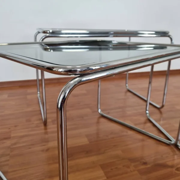 Set of 3 coffee tables from the 70s era. Made in Bauhaus style in Italy. Made of metal chromed legs and glass. In verry good vintage condition with minor signs of use